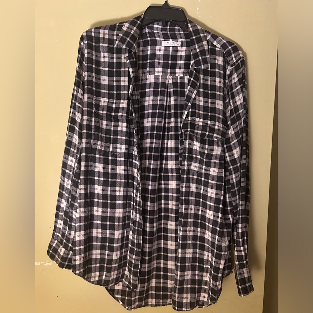 Equipment button barely  worn in size medium